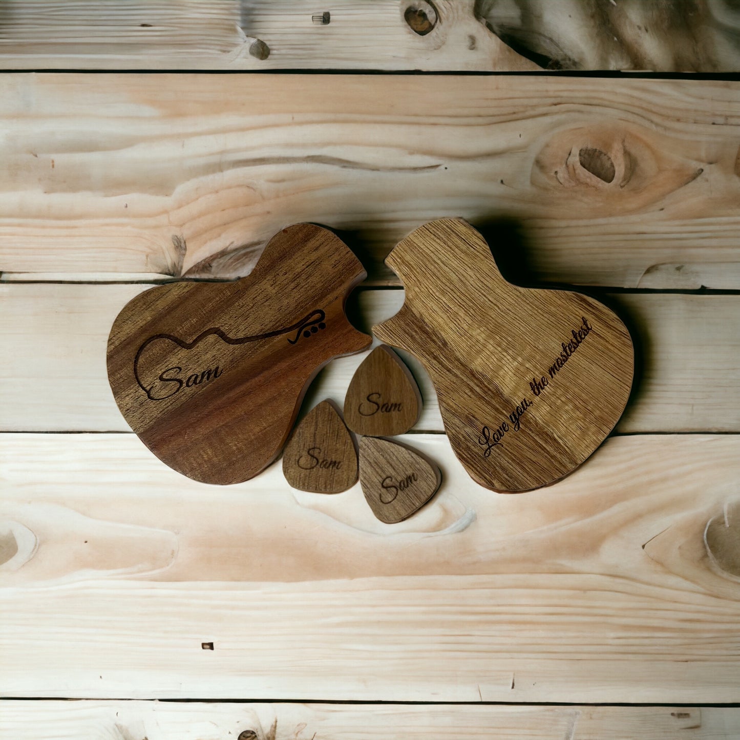 Engraved guitar pics and case with inscription.